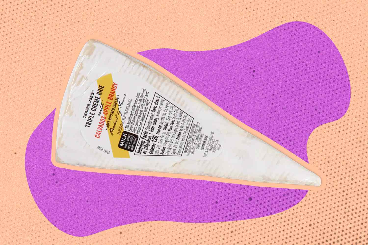 Overhead view of a block of Triple Creme Brie with Calvados Apple Brandy cheese on a pink and lavender speckled background