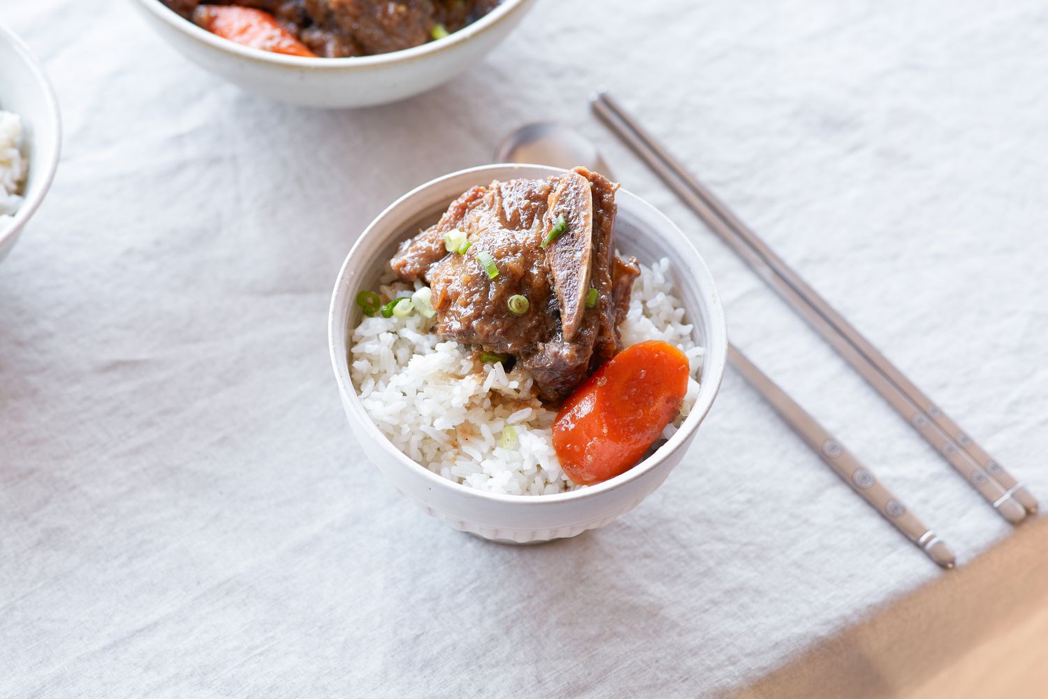 Galbi jjim (braised short ribs) in a bowl along with rice.
