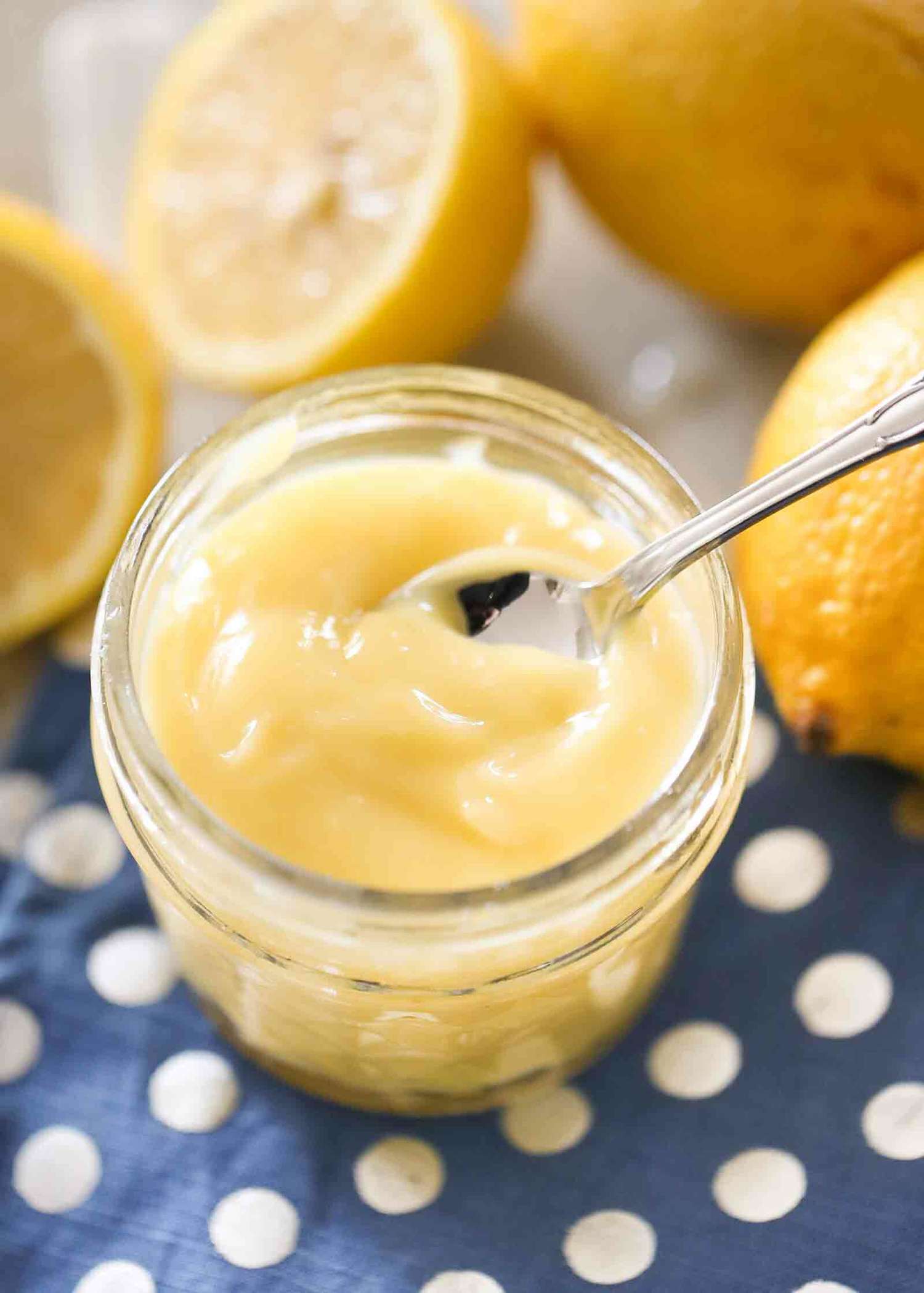 Homemade Lemon Curd in a jar with a spoon