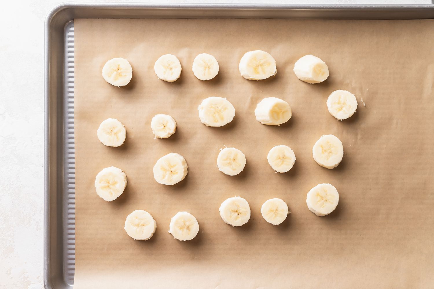 Sliced Bananas on a Tray for Frozen Chocolate Covered Bananas Recipe