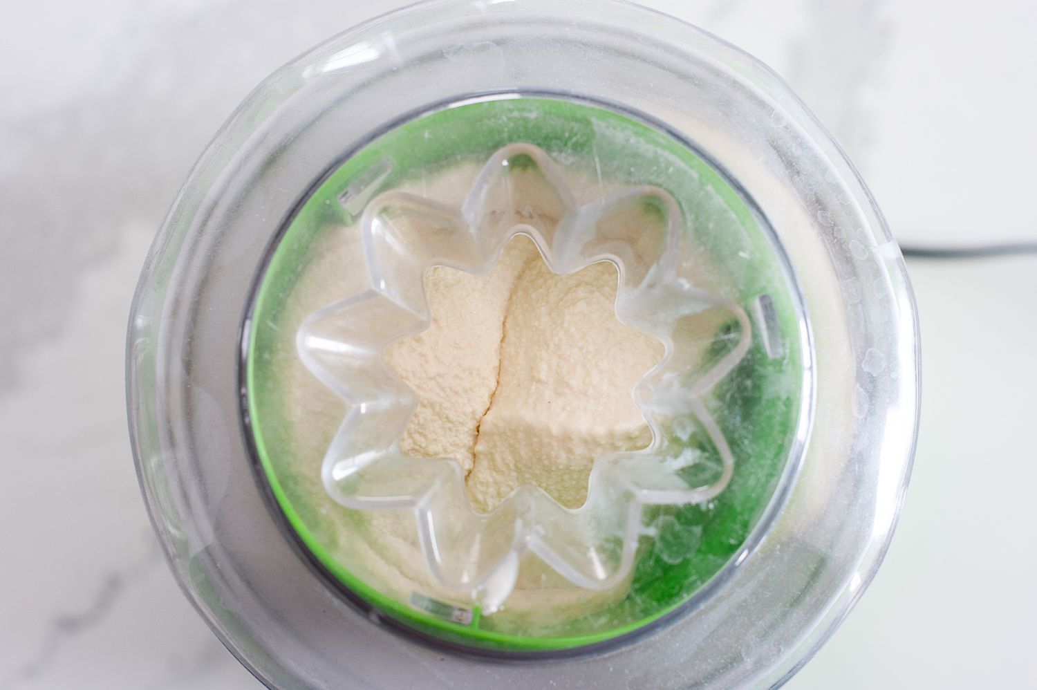 Churning butter pecan ice cream in an ice cream maker.