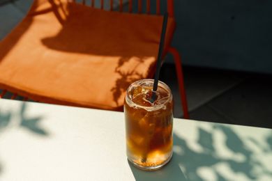 glass of iced coffee with a straw