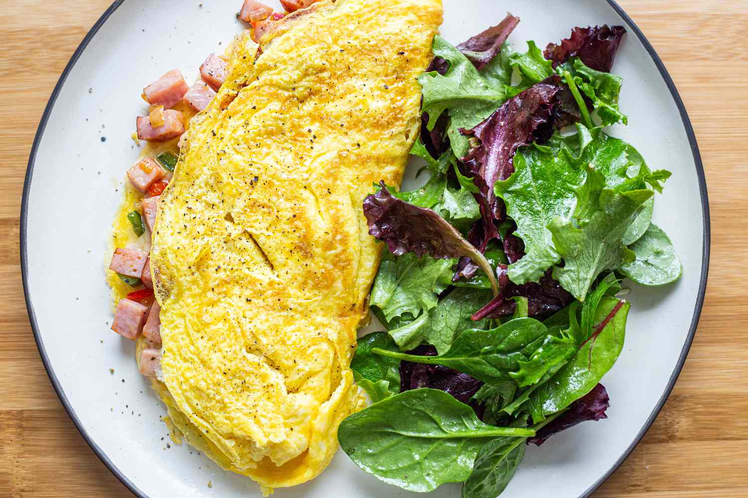 Denver Omelet with Mixed Greens on Plate 