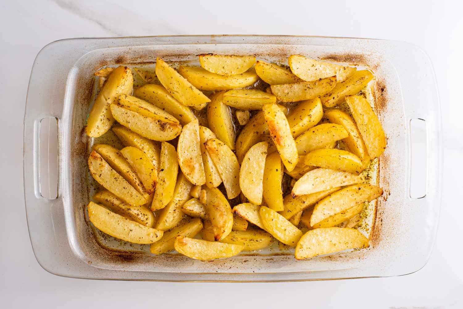 baked greek lemon potatoes in a baking pan