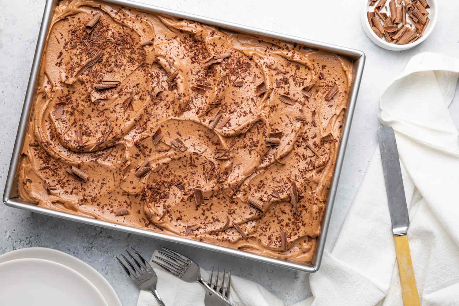 Chocolate Tres Leches Cake with Chocolate Whipping Cream and Garnished with Shaved Chocolate Pieces 