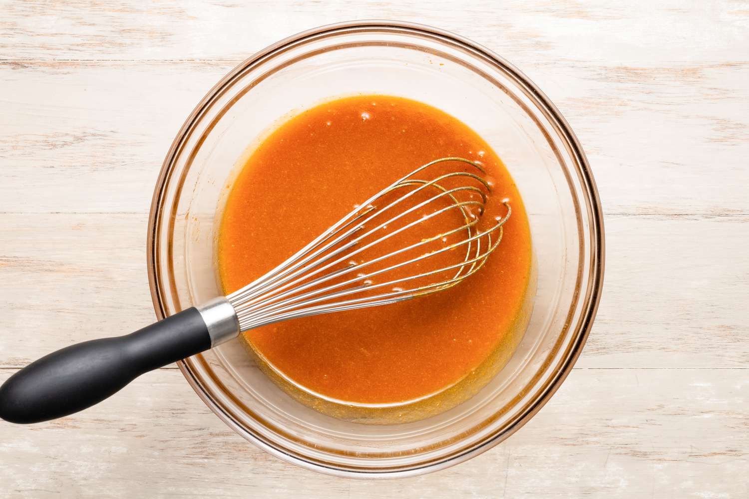 Bowl of wet ingredients whisked together for pumpkin spice snickerdoodle cookies recipe