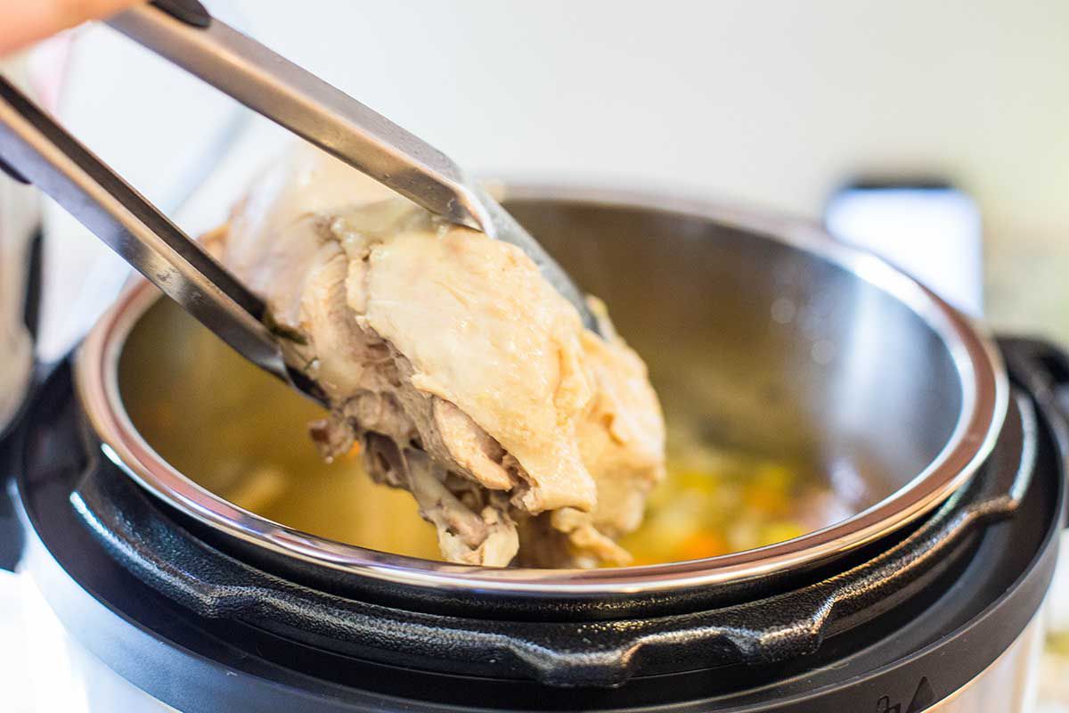 Pressure Cooker Chicken Soup remove the cooked chicken from the Instant Pot