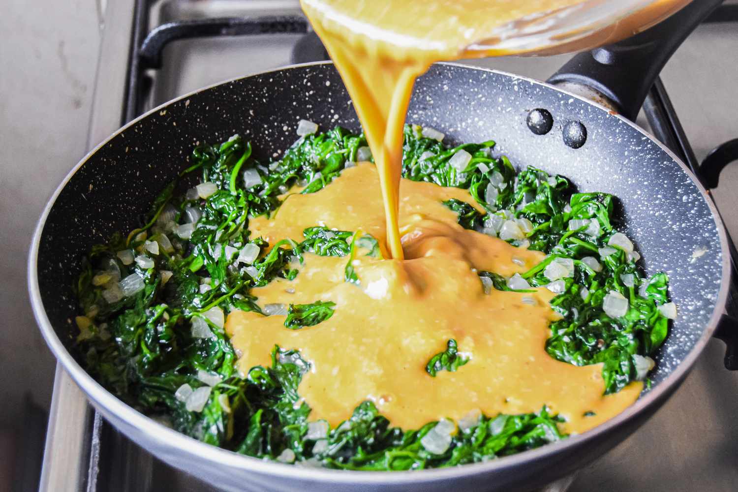 Egg Mixture Added to Pan with Spinach and Onions for Spinach Frittata