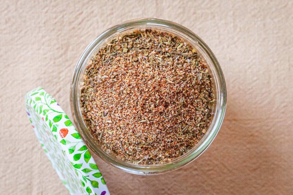 Dry rub chicken wings overhead shot of dry rub in jar with lid on side