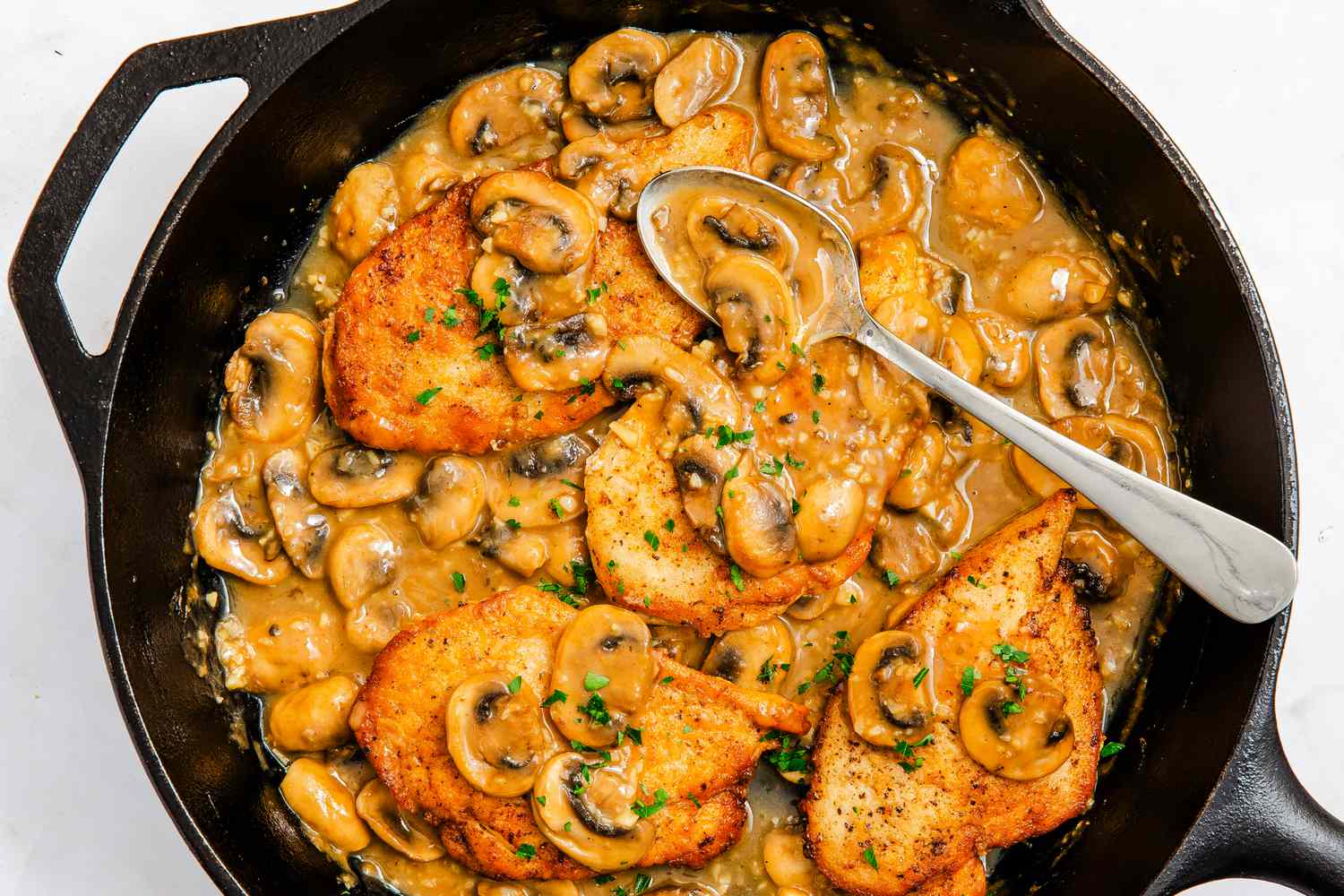chicken marsala in a cast iron skillet
