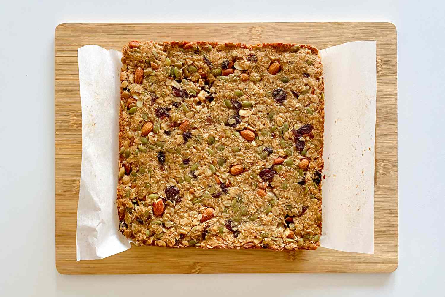 Homemade Chewy Granola Bars on a cutting board.