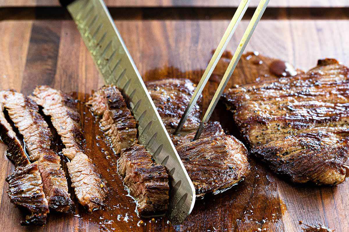 How to Cook Skirt Steak on the Stovetop - slicing steak on cutting board