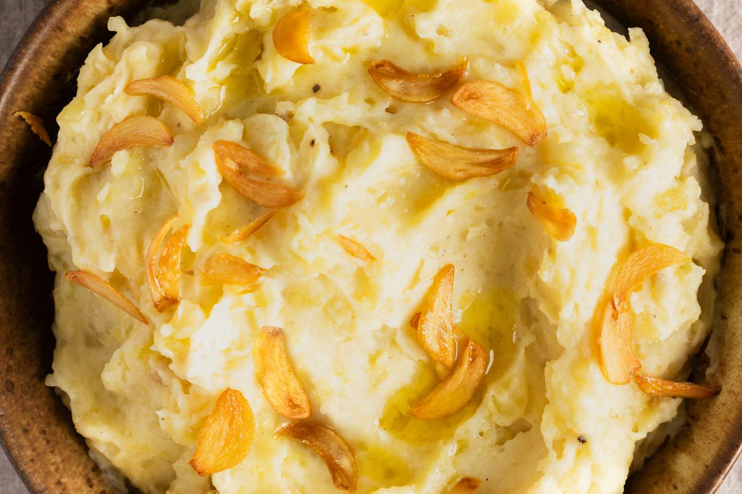 Close up of Too Much Garlic Mashed Potatoes in a brown bowl