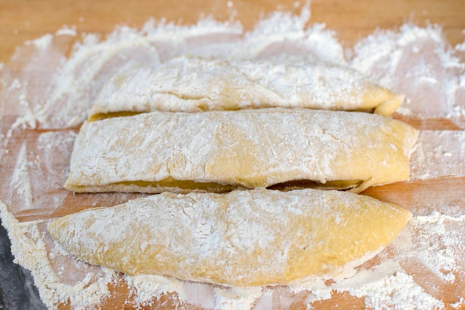 challah dough portioned into 3 