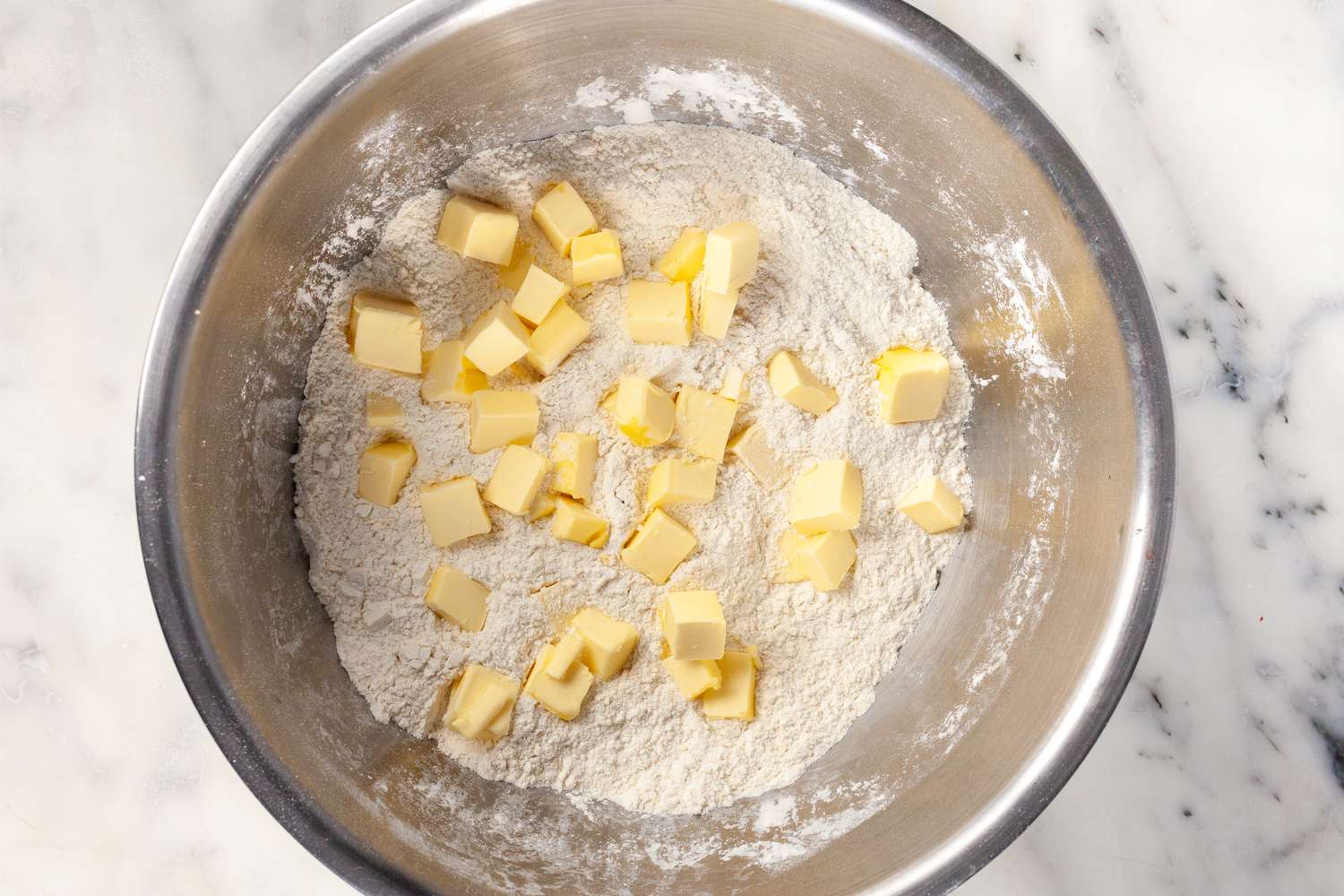 Add butter to dry ingredients.