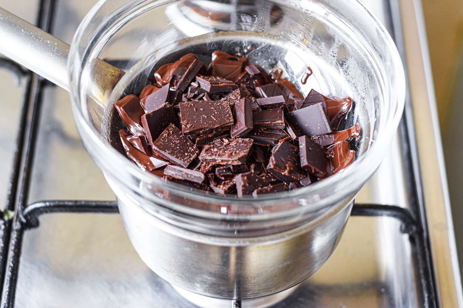 Melting chocolate in a double boiler for Chocolate Bourbon Cake