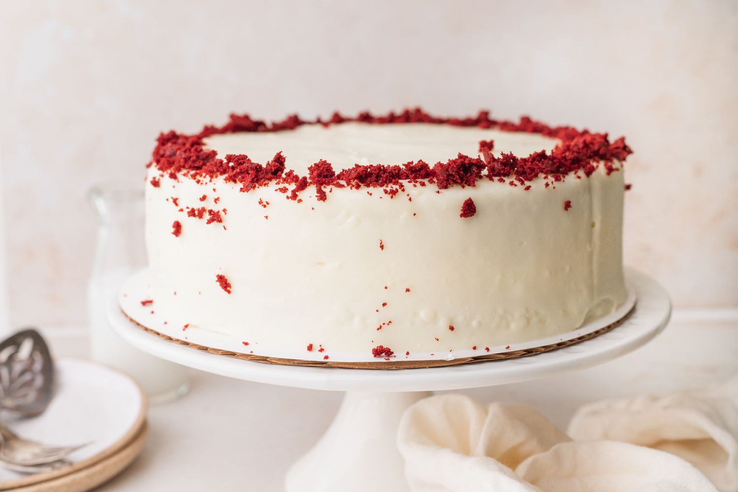 Whole red velvet cake on cake stand