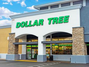 Image of a Dollar Tree store front with partly cloudy skies overhead