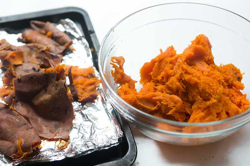 cooked sweet potatoes peeled and added to a bowl
