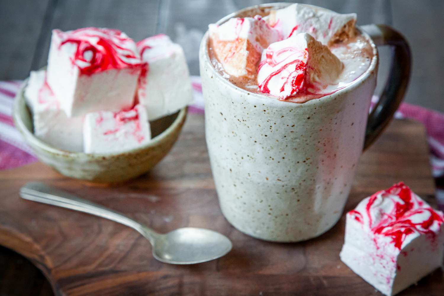 A mug of hot cocoa with homemade peppermint marshmallows in it