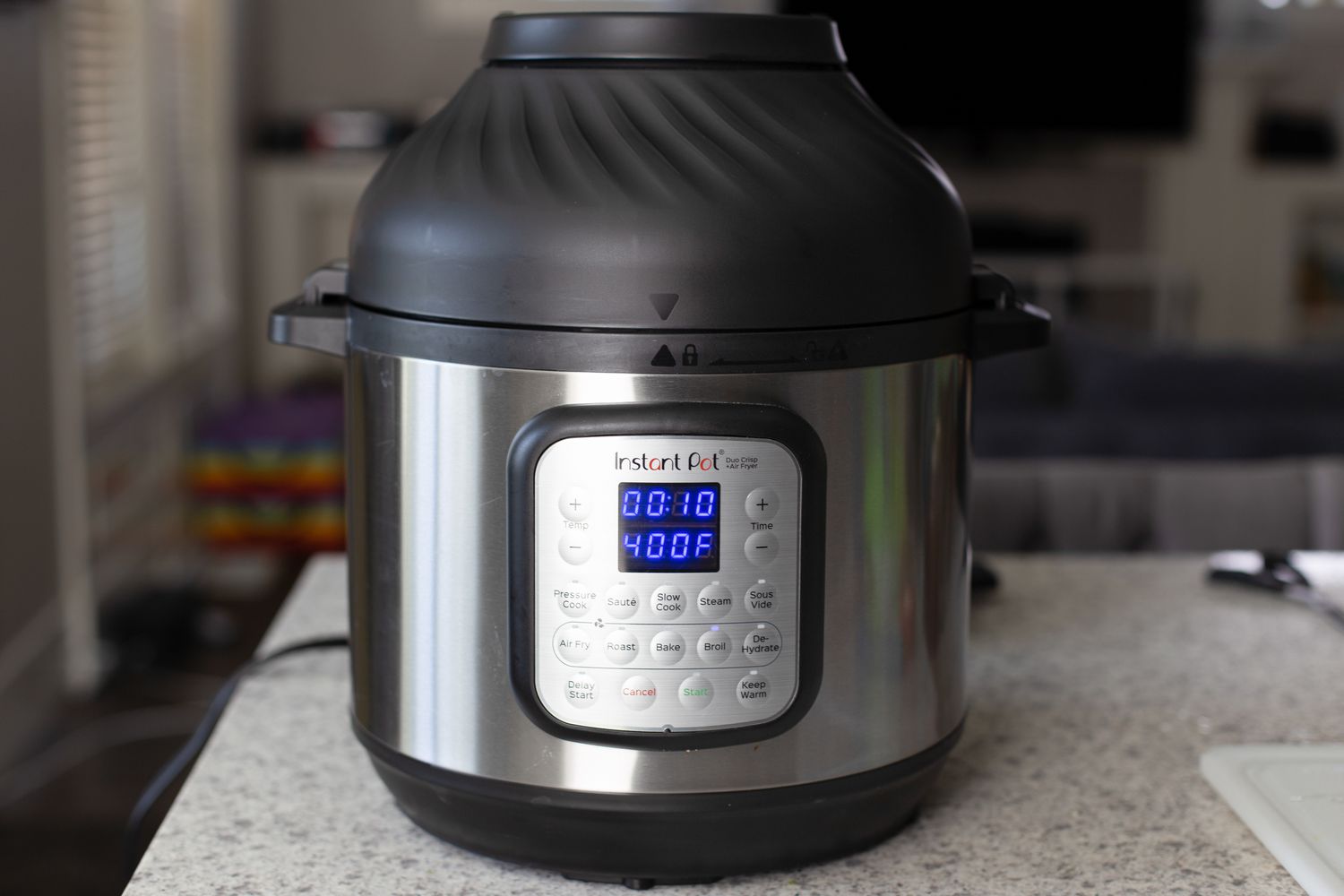 An Instant Pot on a counter cooking a simple instant pot turkey with gravy