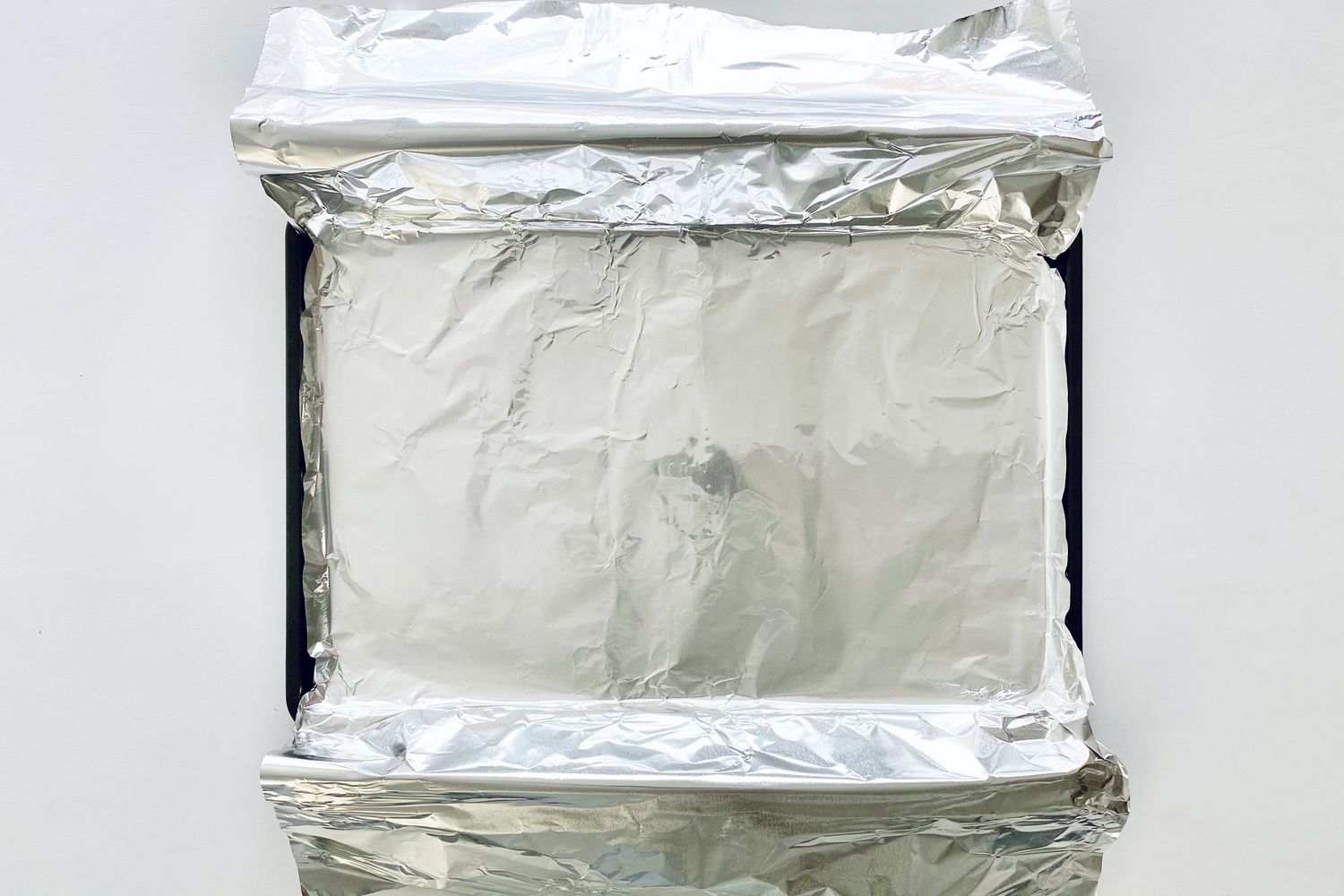 A foil lined baking sheet to make Garlic Butter Baked Salmon.