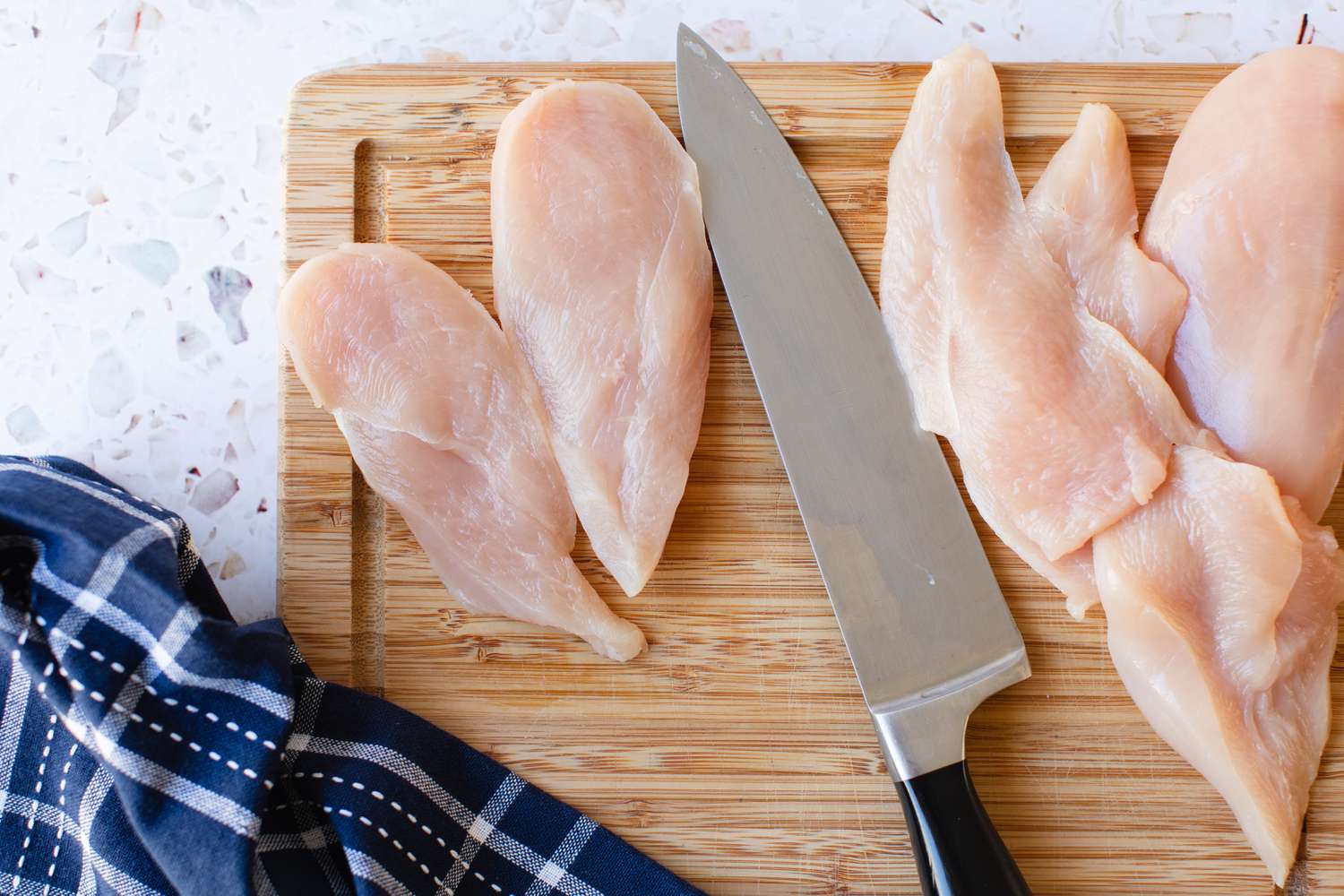 Chicken Breast Sliced in Half for Chicken Piccata Recipe
