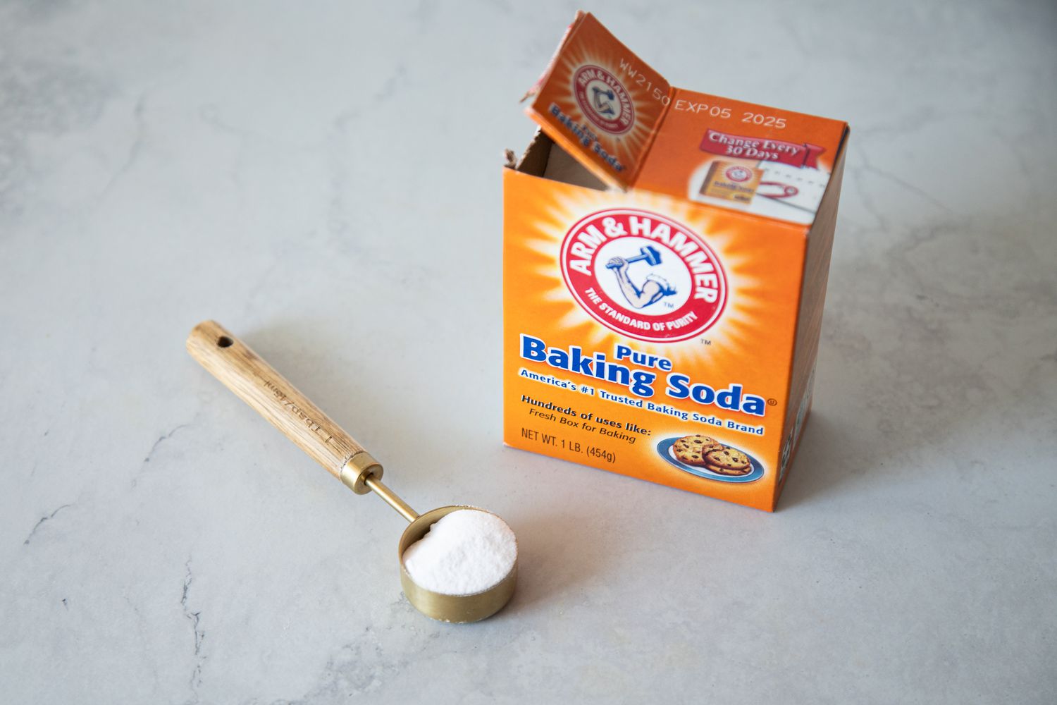 Box of Baking Soda and a Measuring Spoon Full of Baking Soda