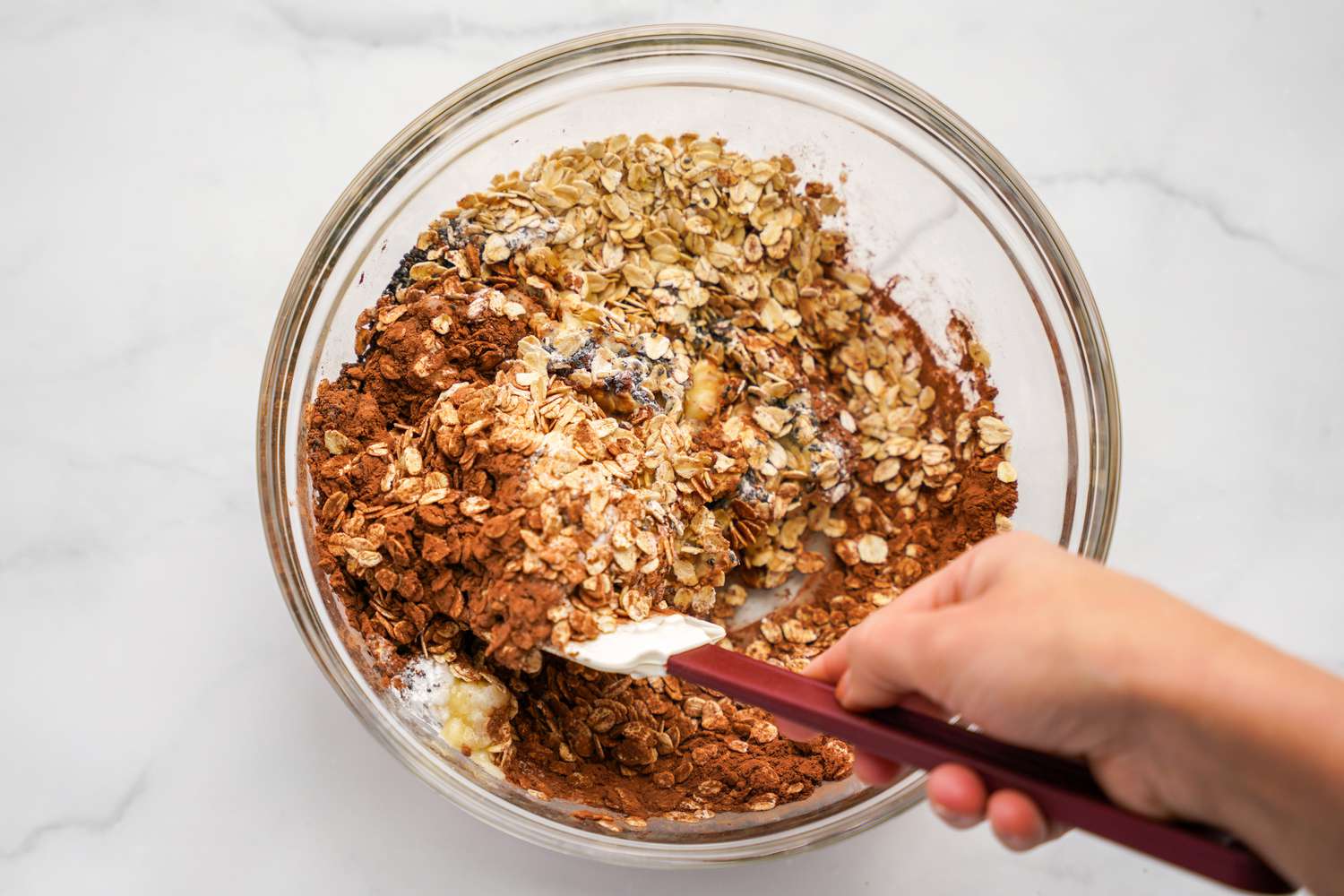 Dry Ingredients Stirred Together Using a Spatula for Vegan Brownie Baked Oatmeal Recipe