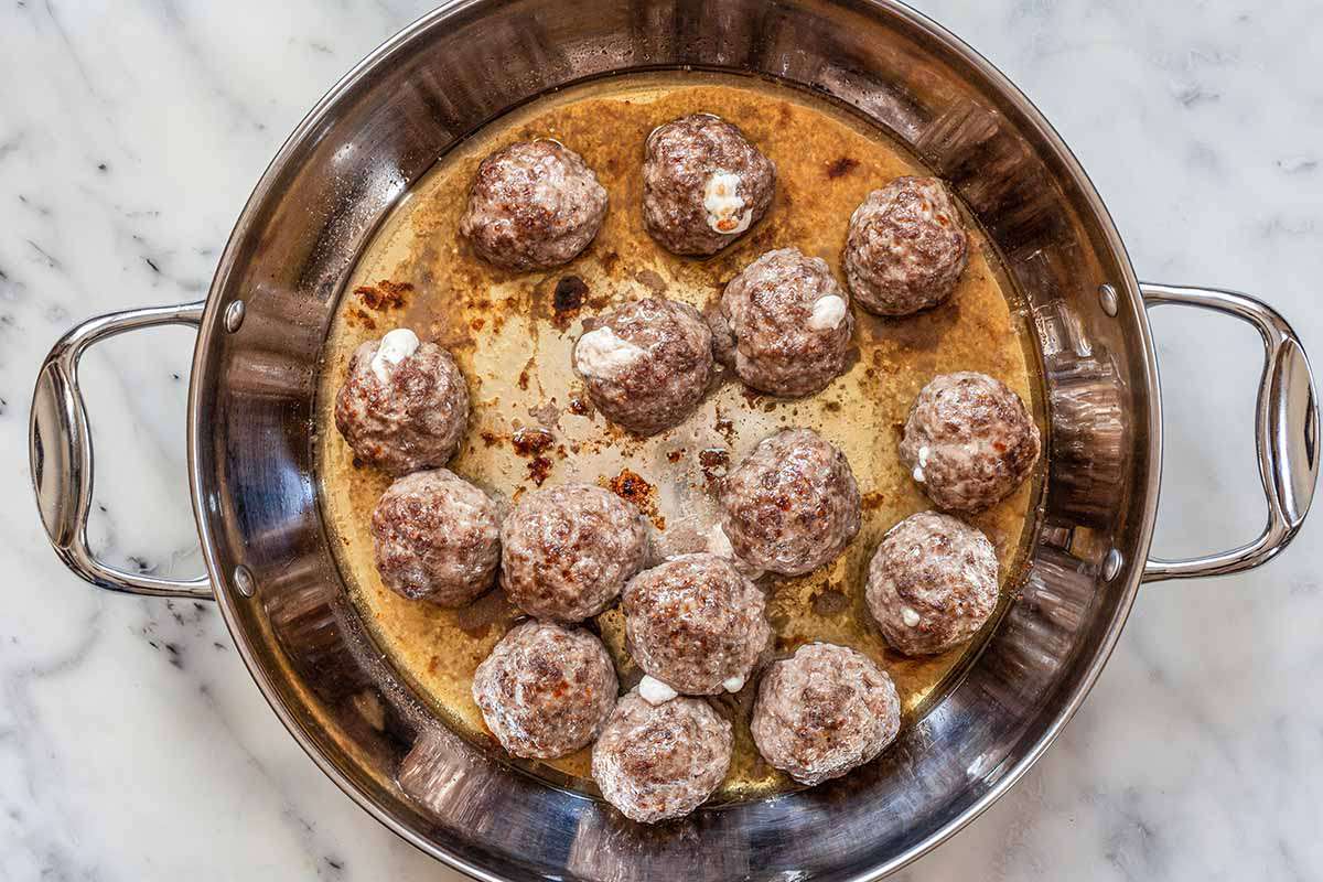 Cheese Stuffed Meatballs - meatballs in skillet