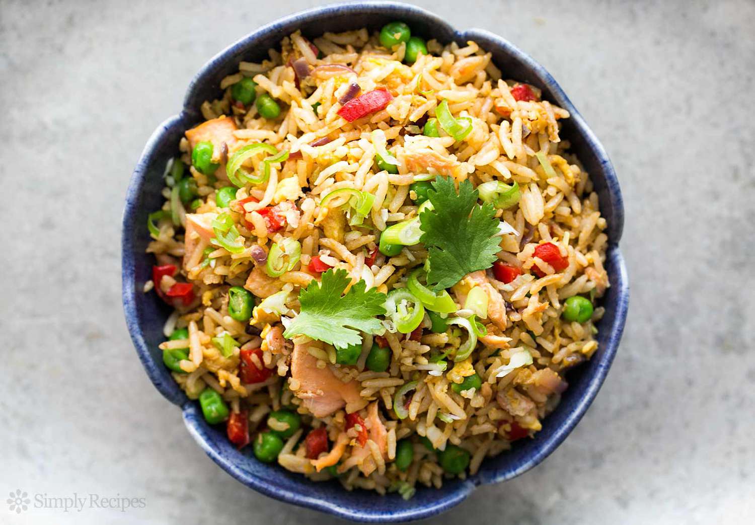 salmon fried rice oiled in a blue bowl