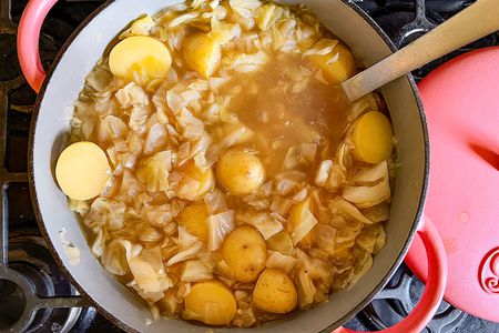 4-Ingredient Cabbage and Potato Soup in a large pot with a ladel