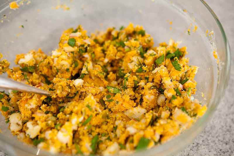 shrimp cake mixture being stirred in bowl