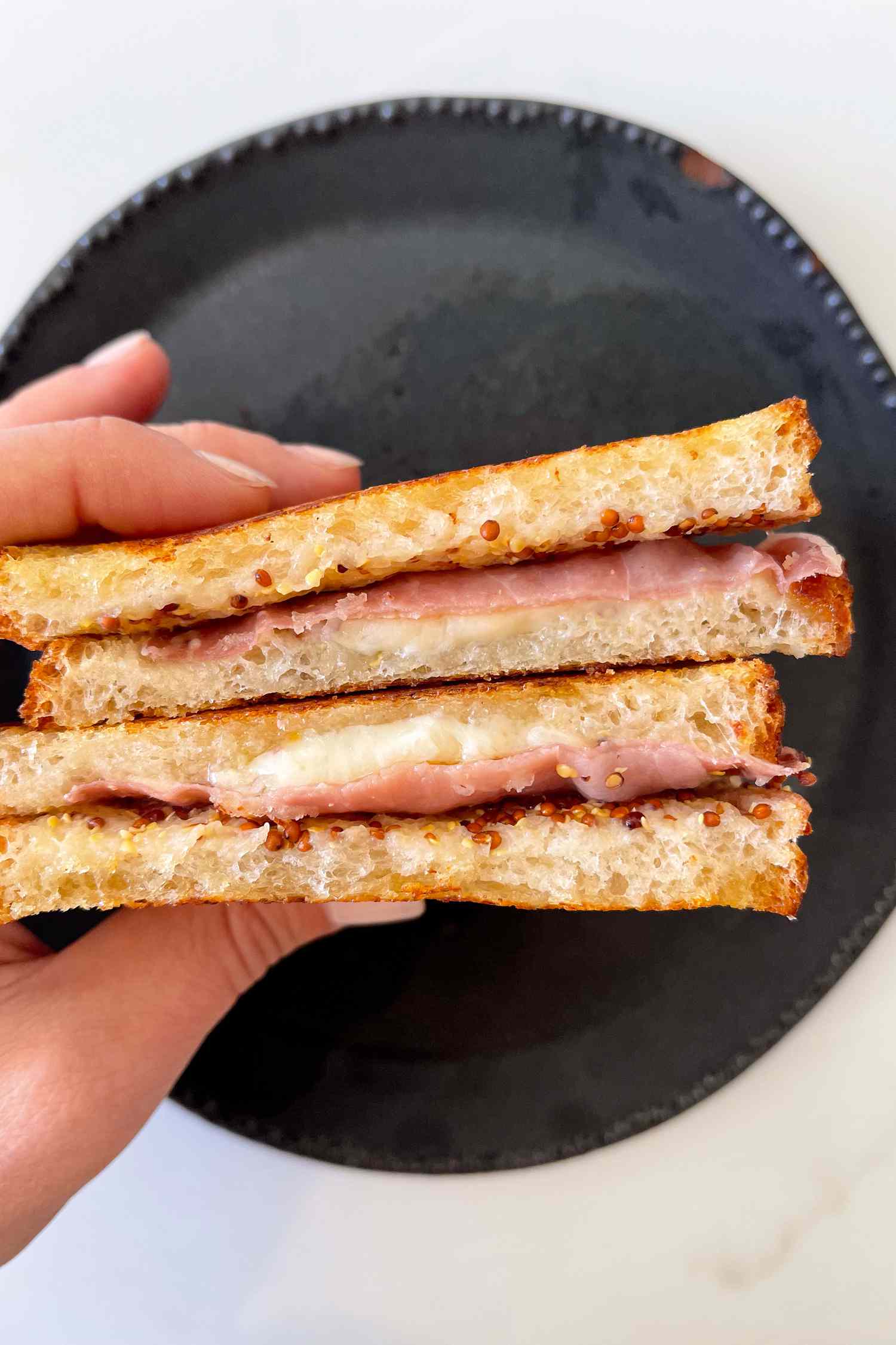 Ina Garten's favorite sandwich being held by a hand
