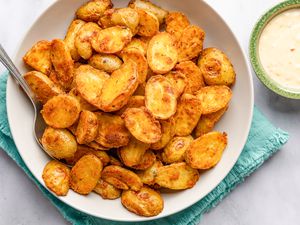 Bang bang potatoes (potatoes in one bowl, sauce in another bowl next to the potatoes)