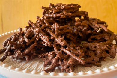 Pile of chocolatecoated pretzel clusters on a plate