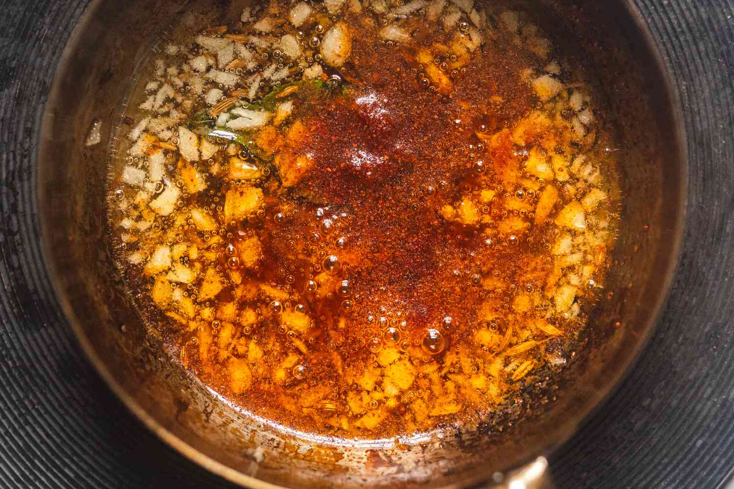 Ground spices adding to oil for how to bloom spices