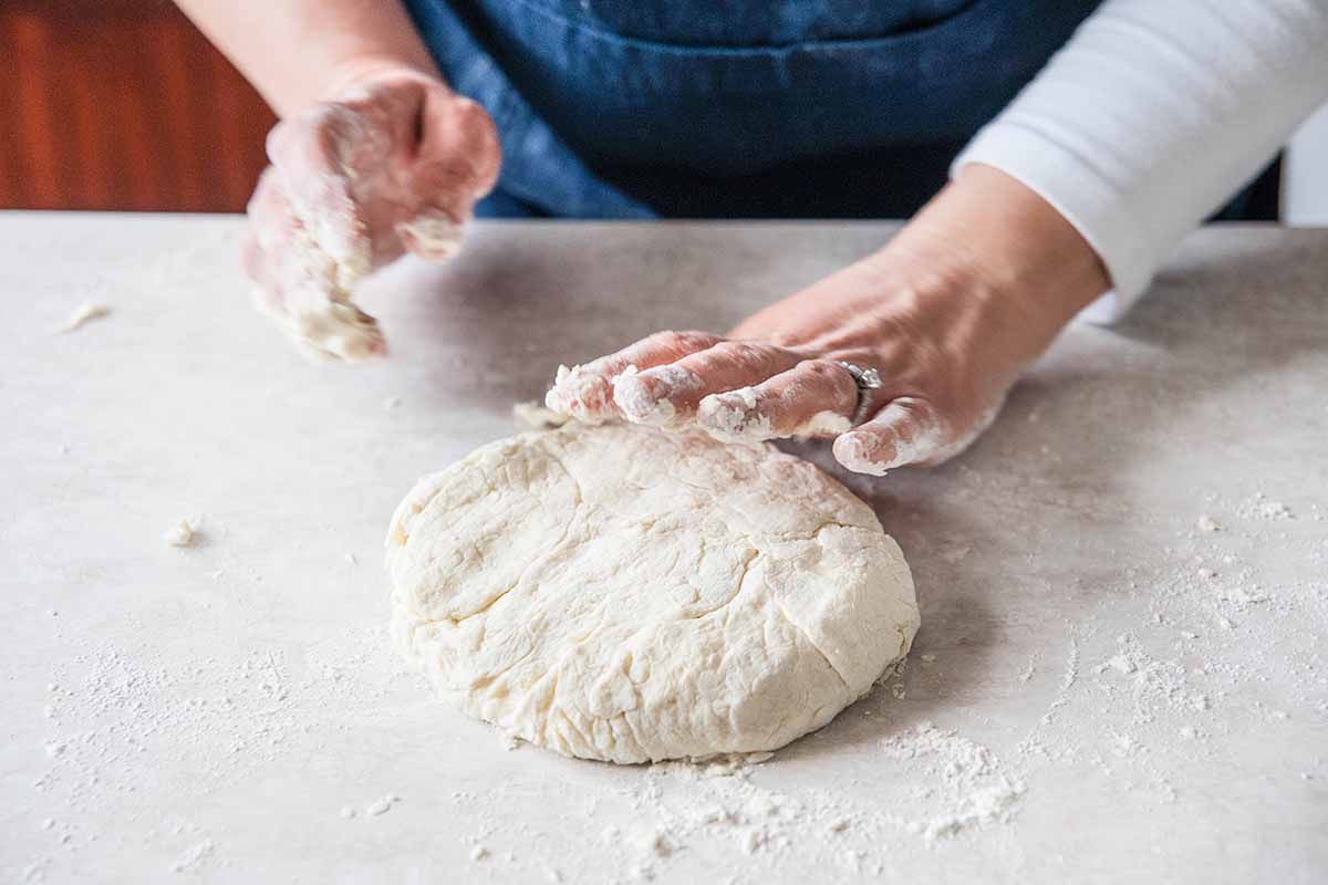 Buttermilk Biscuits Recipe - woman forming round of dough