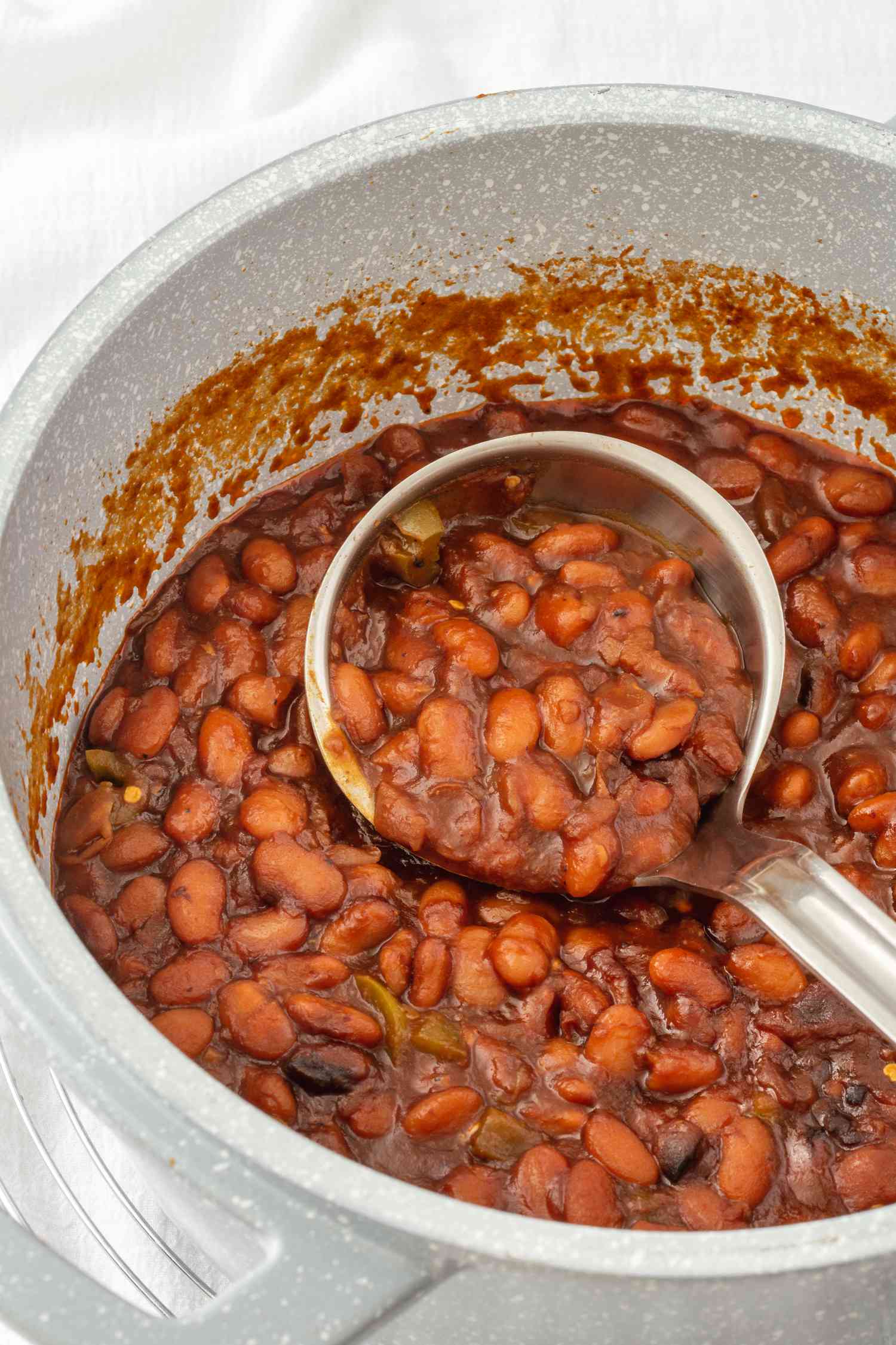 Overhead view of a pot of cowboy baked beans.