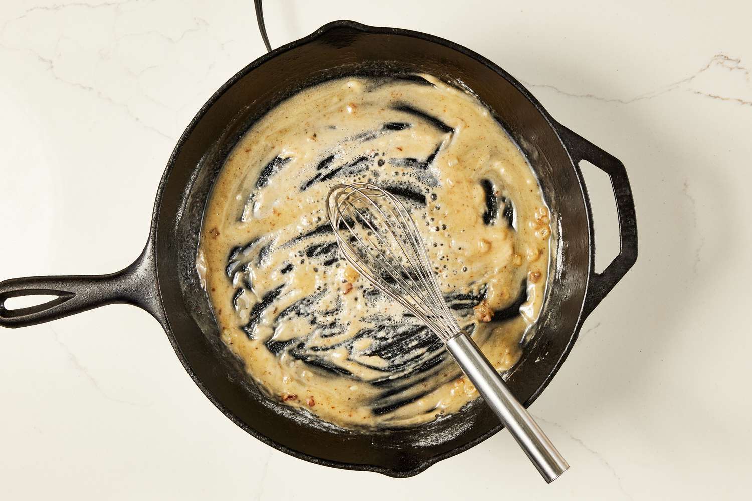 Flour whisked into the melted butter in the cast iron skillet for copycat Ikea meatballs recipe