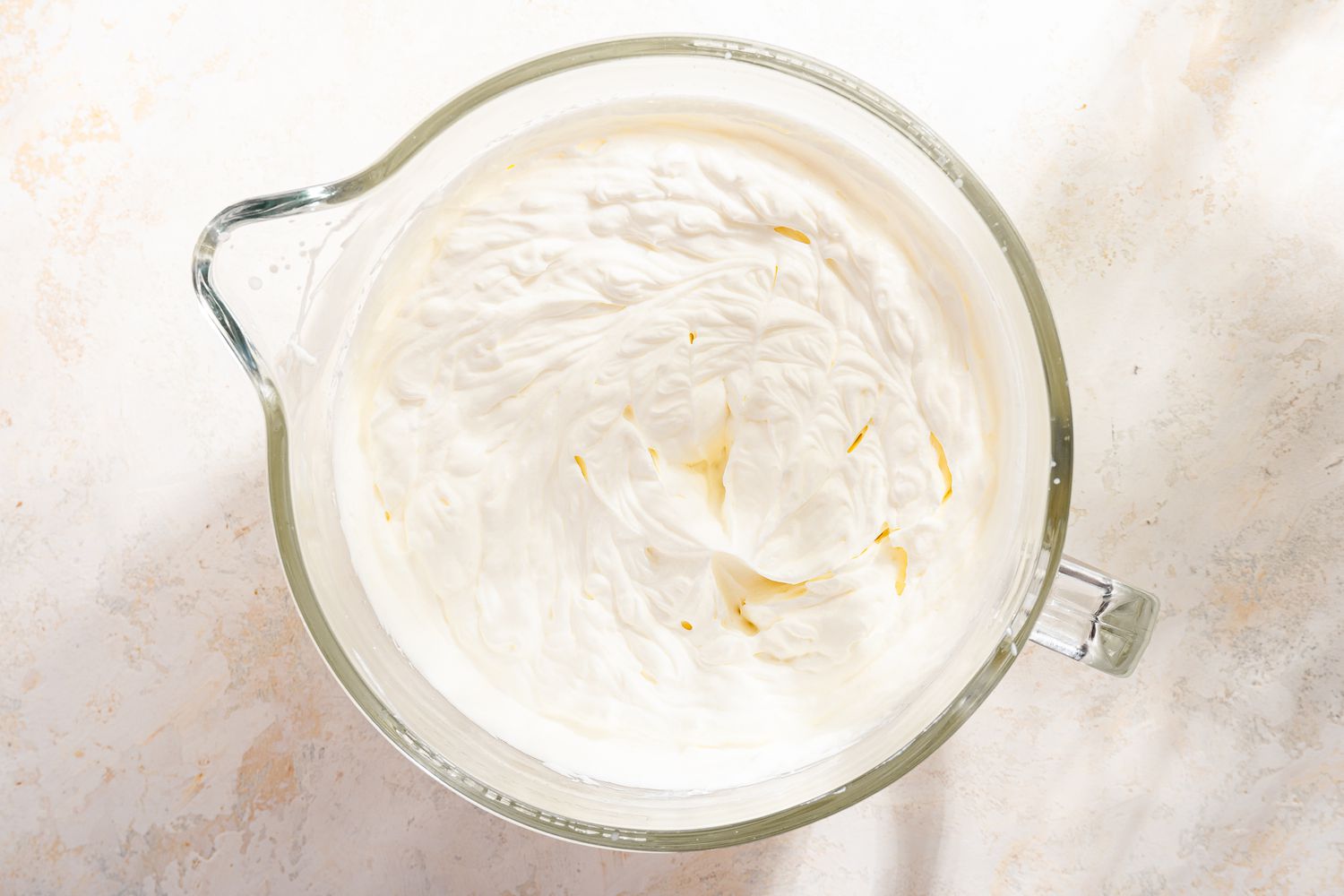 whipped cream in a mixer bowl for mango royale (mango float) recipe