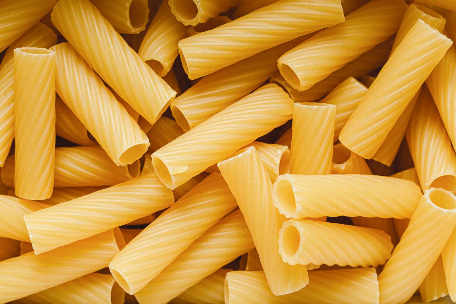 Closeup view of uncooked Rigatoni pasta 