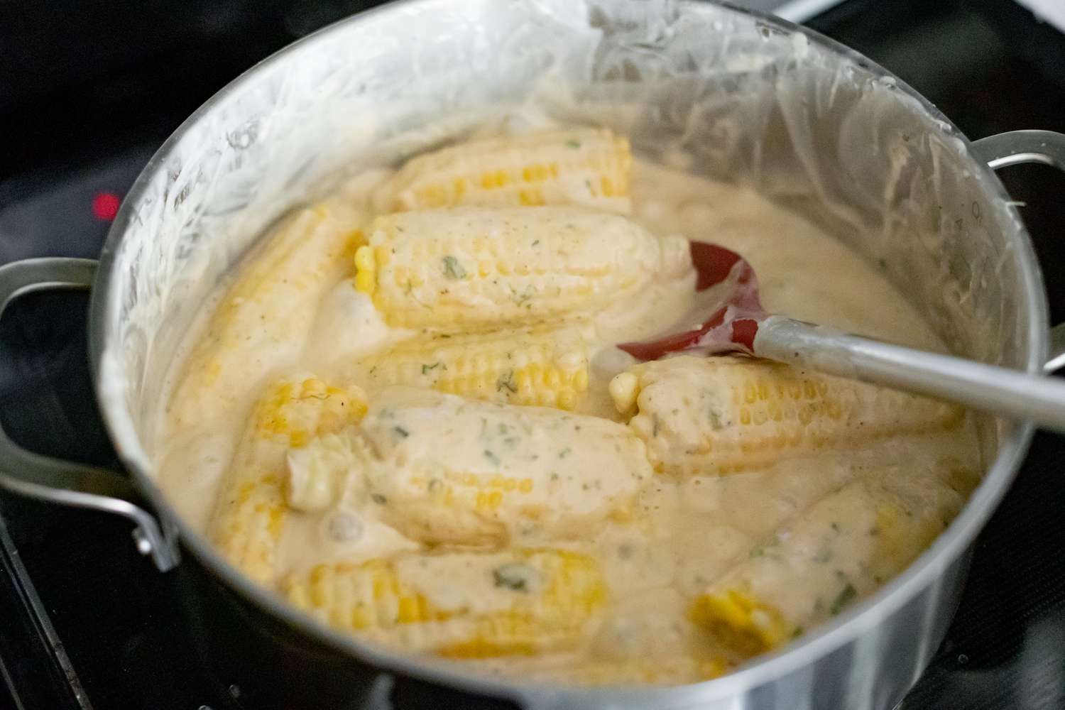 Trinidadian Boiled Corn Stirred with a Spatula