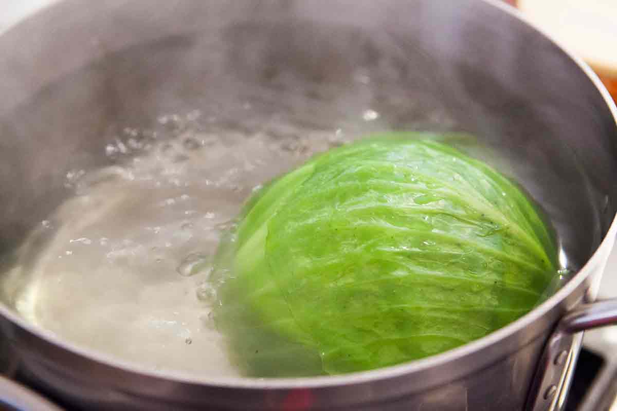 boil a head of cabbage for making stuffed cabbage