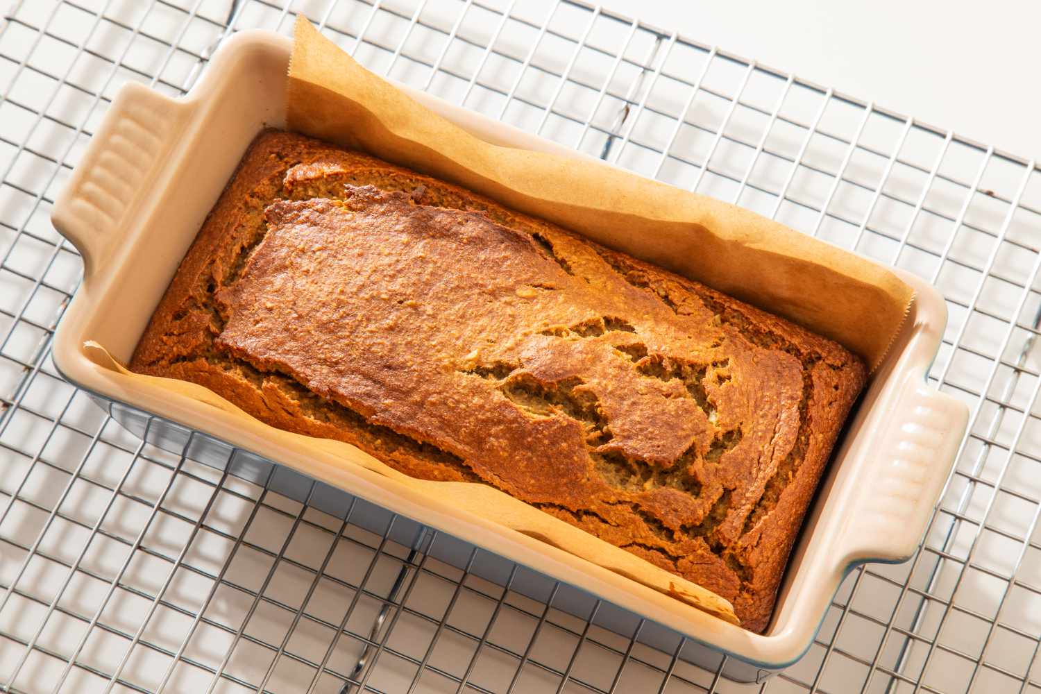 5-Ingredient Blender Banana Bread baked and cooling in pan and on a cooling rack