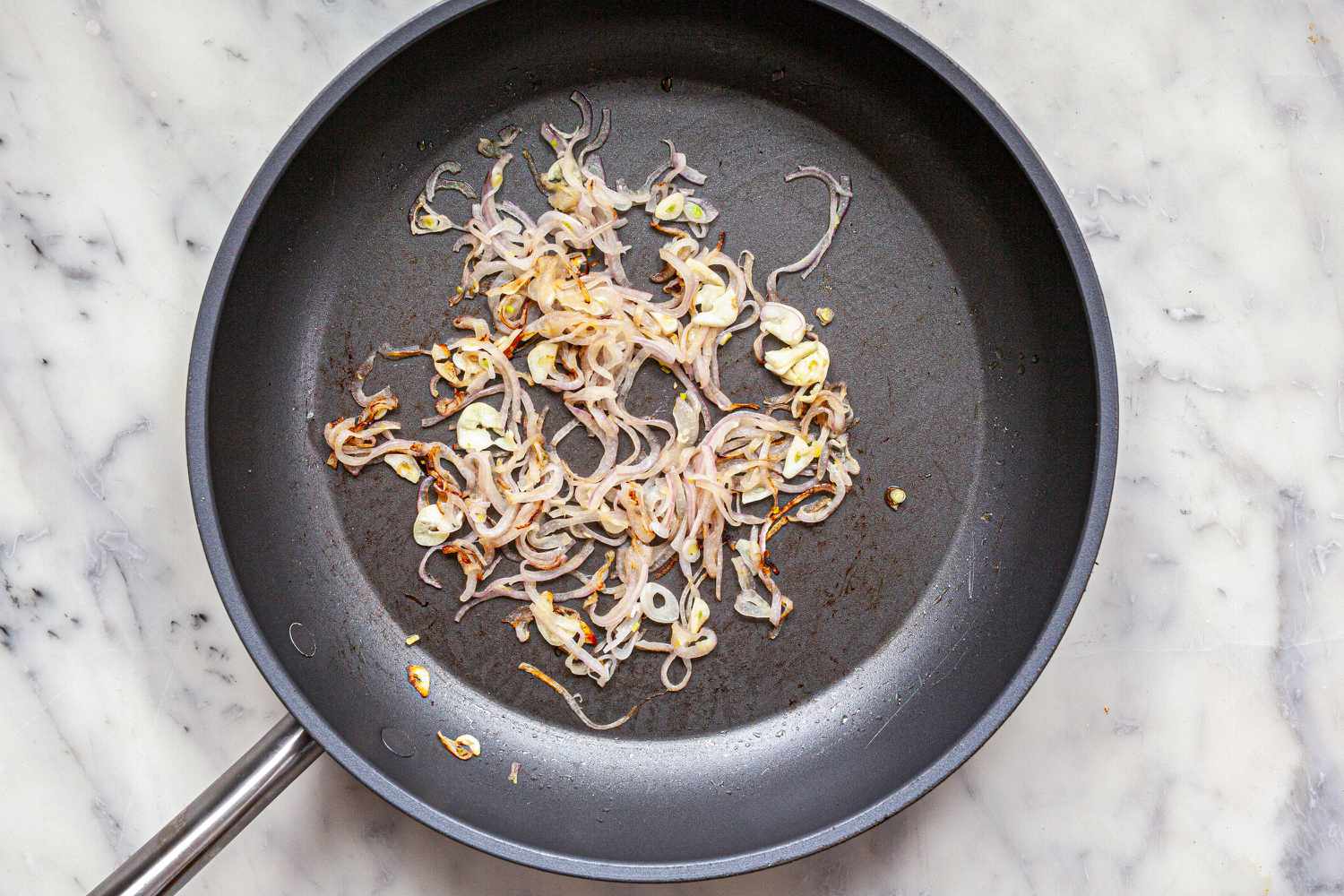 Sauteed red onion to make Mexican Enfrijoladas.