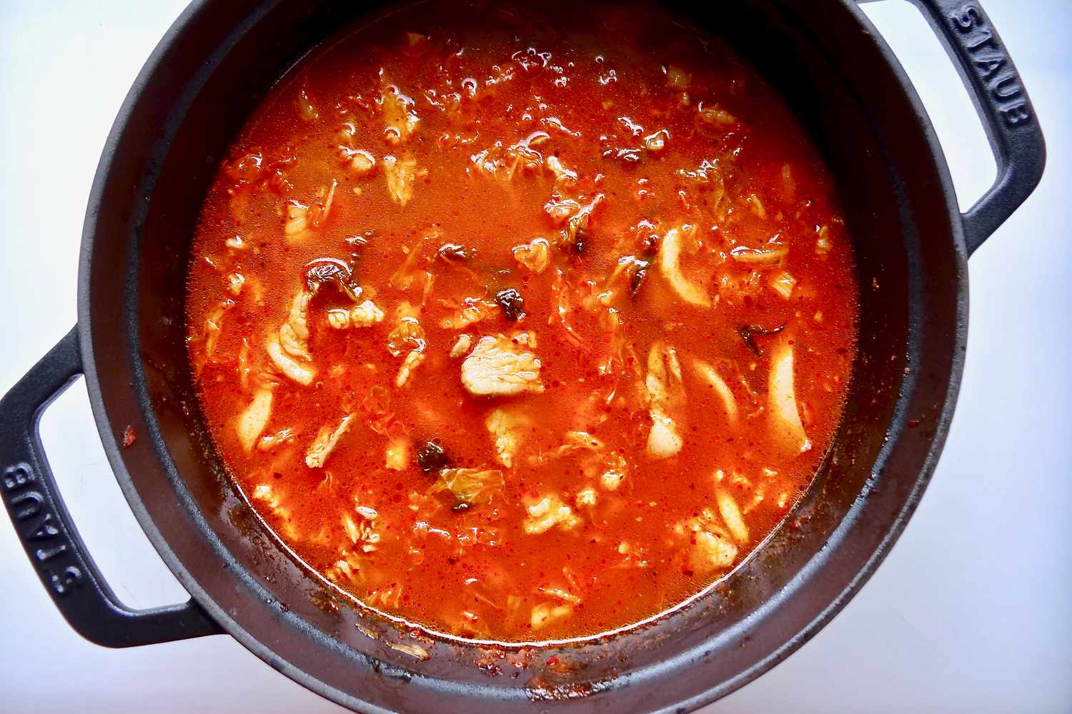 Pork belly and kimchi jjigae in a dutch oven.