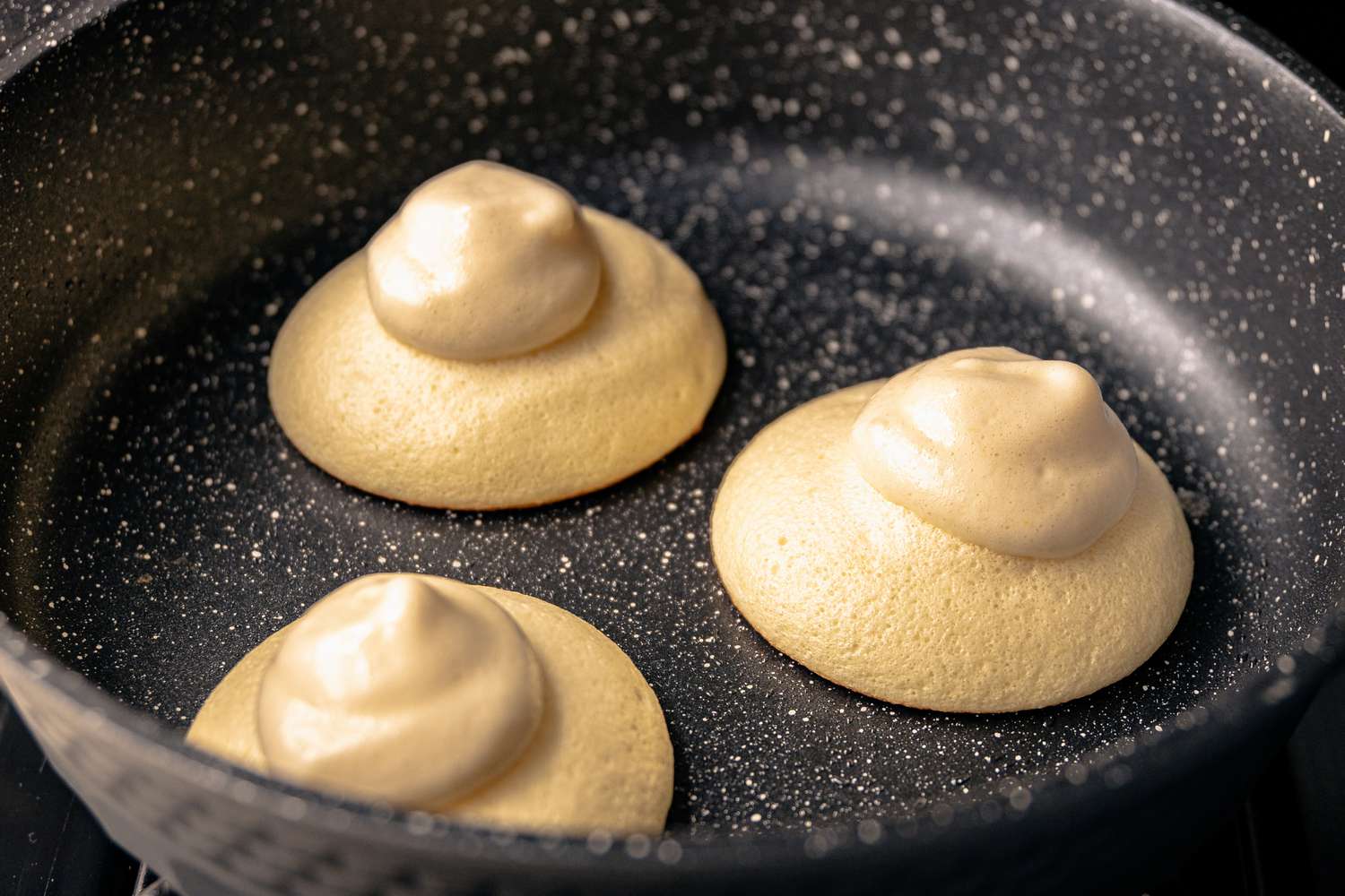 Three Piles of Batter in Skillet for Souffle Pancakes