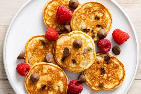 Buckeye Pancakes on a Plate with Raspberries and Chocolate Chips