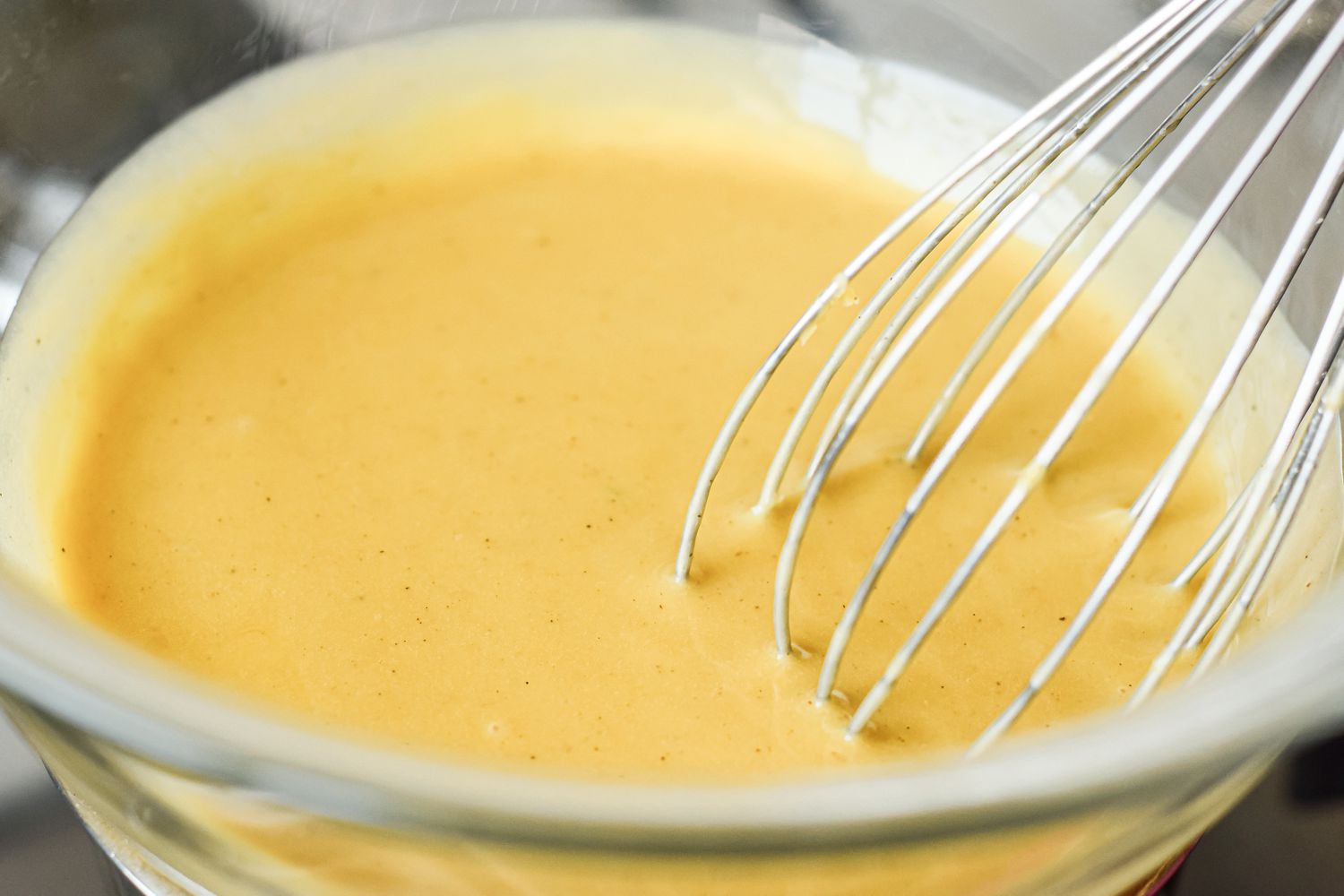 Whisking custard for a abaglione recipe.